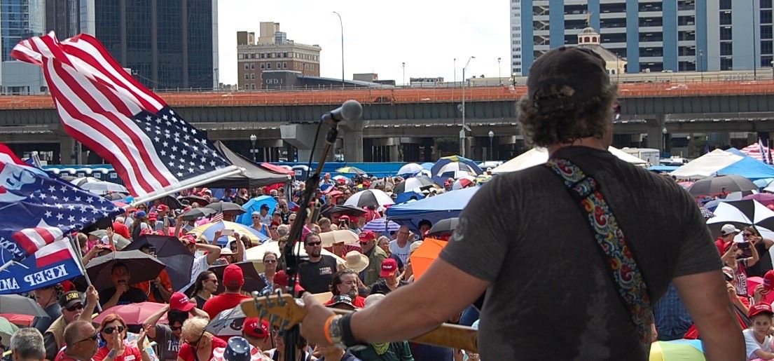 Guitarist Playing In A Large Crowd